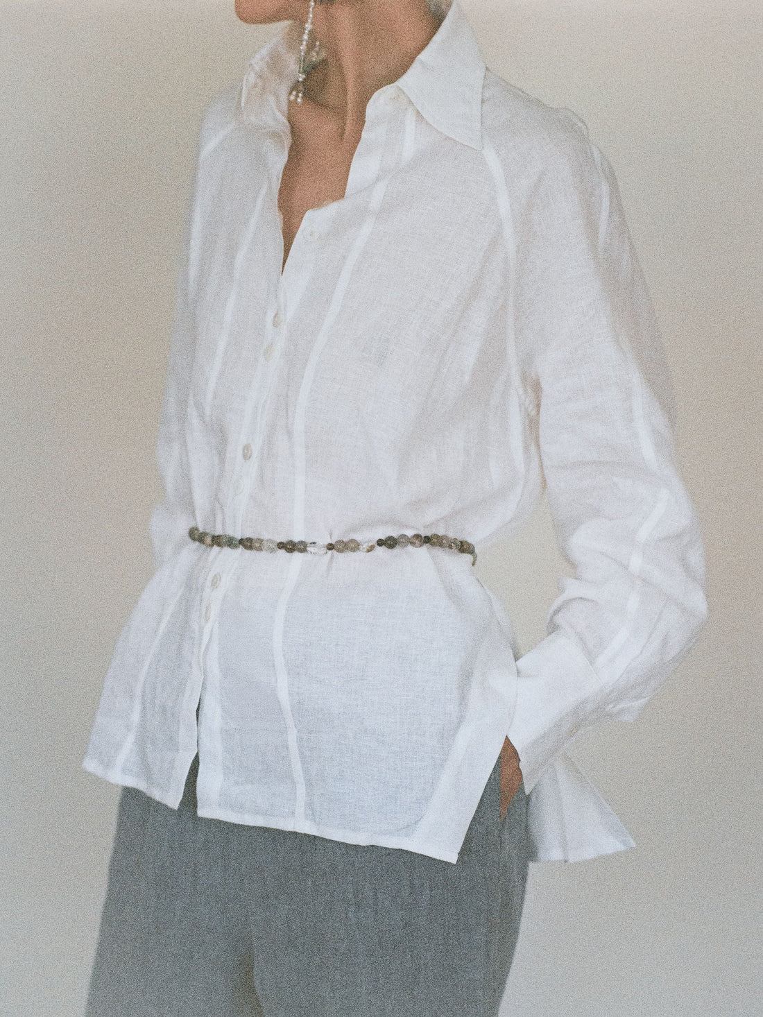 Beaded crystal belt on white linen shirt