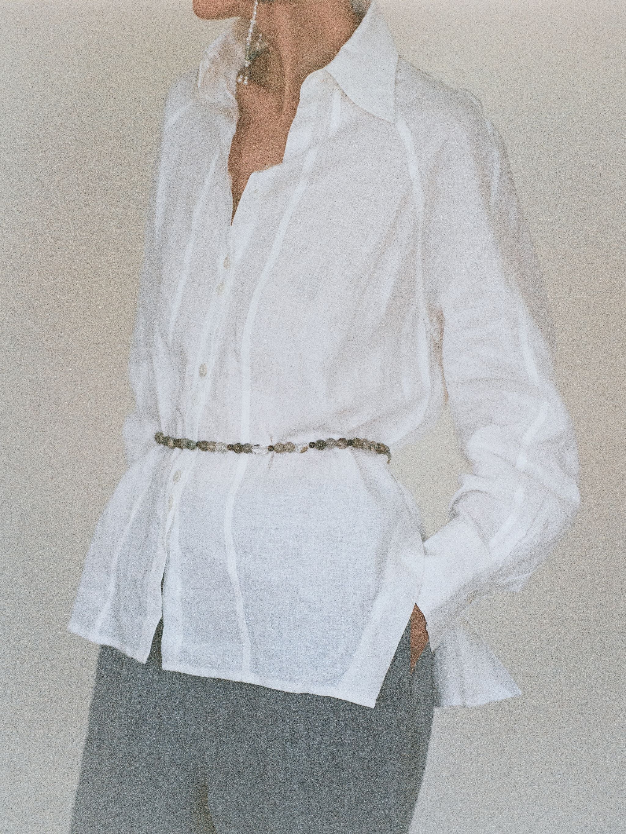 Beaded crystal belt on white linen shirt