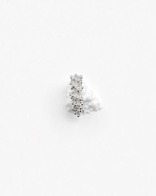 Magata textured silver ring with bubbly surface on white background