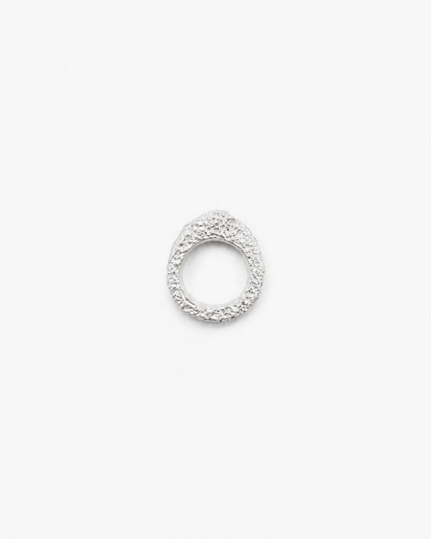 Silver ring with lava texture design on a white background